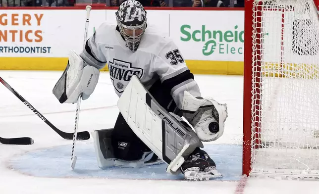Los Angeles Kings goaltender Darcy Kuemper (35) snares a shot by the Carolina Hurricanes during the second period of an NHL hockey game in Raleigh, N.C., Saturday, Feb. 1, 2025. (AP Photo/Karl DeBlaker)