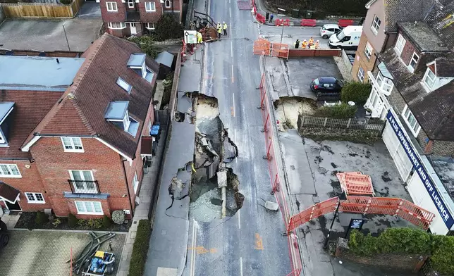 A large sinkhole appeared on Monday night is seen in Godstone, England, Tuesday Feb. 18, 2025. (Jonathan Brady/PA via AP)