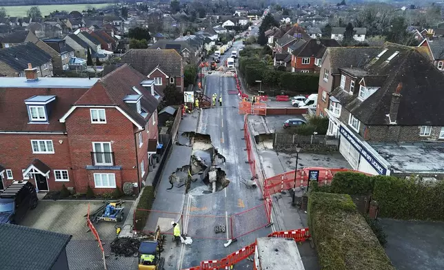 A large sinkhole appeared on Monday night is seen in Godstone, England, Tuesday Feb. 18, 2025. (Jonathan Brady/PA via AP)