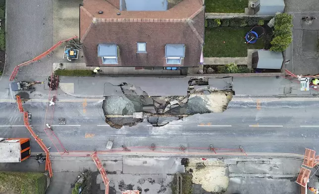 A large sinkhole appeared on Monday night is seen in Godstone, England, Tuesday Feb. 18, 2025. (Jonathan Brady/PA via AP)
