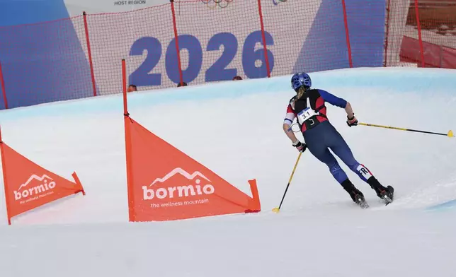 France's Emily Harrop competes during the women's mixed relay race at the Ski Mountaineering World Cup event in Bormio, Italy, Sunday, Feb. 23, 2025. (AP Photo/Antonio Calanni)