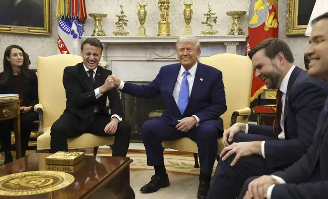 France's President Emmanuel Macron, from second left, speaks with President Donald Trump as Vice President JD Vance and Secretary of State Marco Rubio react during a meeting in the Oval Office of the White House in Washington, Monday, Feb. 24, 2025. (Ludovic Marin/Pool via AP)