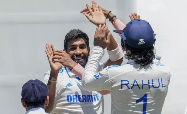 FILE - India's Jasprit Bumrah celebrates with teammates after the wicket of Australia's Mitchell Marsh during play on the day four of the fourth cricket test between Australia and India at the Melbourne Cricket Ground, Melbourne, Australia, Dec. 29, 2024. (AP Photo/Asanka Brendon Ratnayake, File)