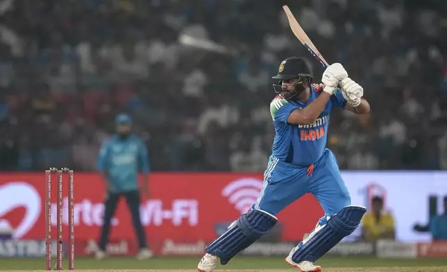 India's captain Rohit Sharma plays a shot during the second one day international cricket match between India and England in Cuttack, India, Sunday, Feb. 9, 2025. (AP Photo/Rafiq Maqbool)