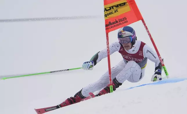 Brazil's Lucas Pinheiro Braathen competes in a men's giant slalom, at the Alpine Ski World Championships, in Saalbach-Hinterglemm, Austria, Friday, Feb. 14, 2025. (AP Photo/Giovanni Auletta)