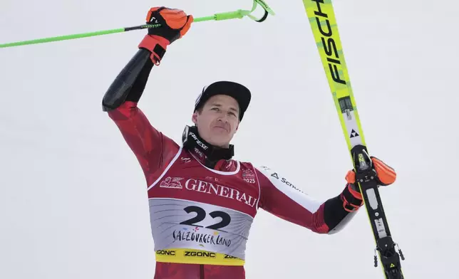 Austria's Raphael Haaser celebrates winning the gold medal in a men's giant slalom, at the Alpine Ski World Championships, in Saalbach-Hinterglemm, Austria, Friday, Feb. 14, 2025. (AP Photo/Giovanni Auletta)