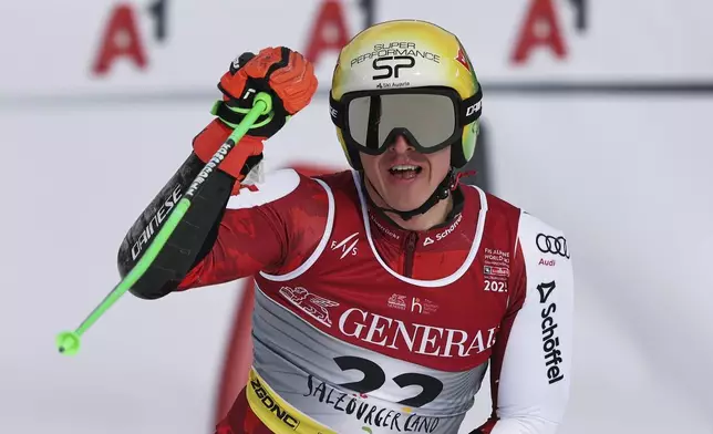 Austria's Raphael Haaser celebrates at the finish area of a men's giant slalom, at the Alpine Ski World Championships, in Saalbach-Hinterglemm, Austria, Friday, Feb. 14, 2025. (AP Photo/Marco Trovati)