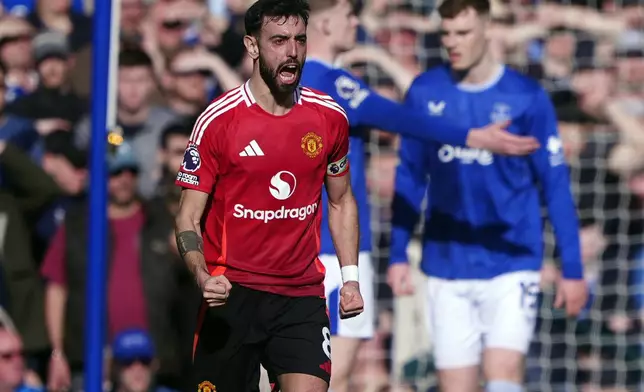 Manchester United's Bruno Fernandes celebrates scoring his side's first goal, during the English Premier League soccer match between Everton and Manchester United, at Goodison Park, in Liverpool, England, Saturday, Feb. 22, 2025. (Peter Byrne/PA via AP)