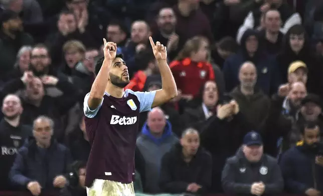 Aston Villa's Marco Asensio celebrates after scoring his second goal against Chelsea during the English Premier League soccer match between Aston Villa and Chelsea at Villa Park in Birmingham, England, Saturday, Feb. 22, 2025. (AP Photo/Rui Viera)