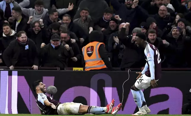 Aston Villa's Marco Asensio, left, celebrates after scoring his second goal against Chelsea during the English Premier League soccer match between Aston Villa and Chelsea at Villa Park in Birmingham, England, Saturday, Feb. 22, 2025. (AP Photo/Rui Viera)