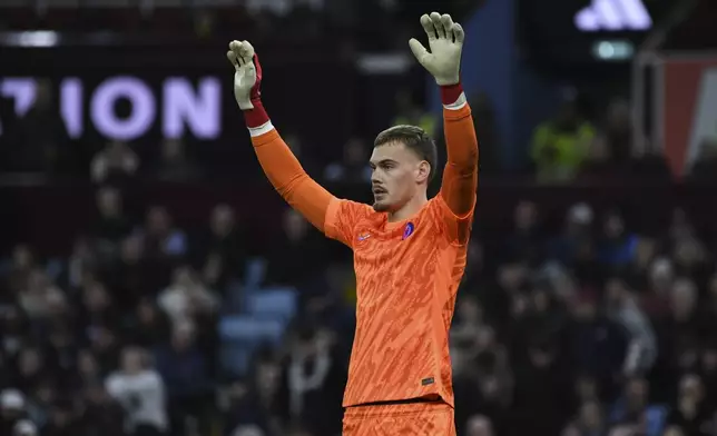Chelsea's goalkeeper Filip Joergensen reacts during the English Premier League soccer match between Aston Villa and Chelsea at Villa Park in Birmingham, England, Saturday, Feb. 22, 2025. (AP Photo/Rui Viera)