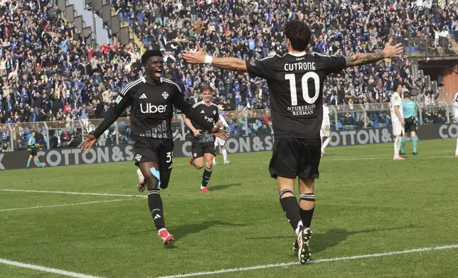 Como's Diao Diaoune Assane celebrates after scoring during the Italian Serie A between soccer match between Como and Napoli at the Giuseppe Sinigaglia stadium in Como, north Italy, Sunday, Feb. 23, 2025. (Antonio Saia/LaPresse via AP)