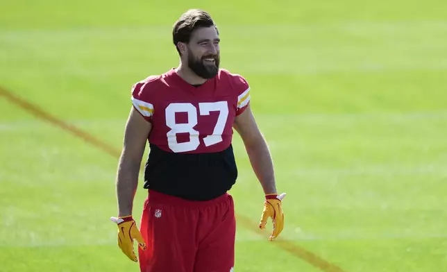 Kansas City Chiefs tight end Travis Kelce (87) talks with teammates during an NFL football practice Wednesday, Feb. 5, 2025, in New Orleans, ahead of Super Bowl 59 against the Philadelphia Eagles. (AP Photo/Brynn Anderson)