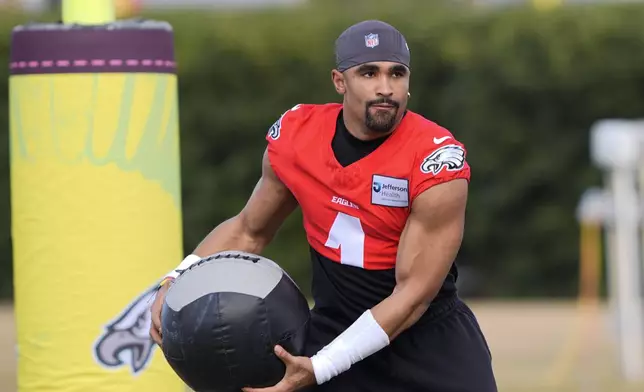 Philadelphia Eagles quarterback Jalen Hurts (1) runs through drills during an NFL football practice Wednesday, Feb. 5, 2025, in New Orleans, ahead of Super Bowl 59 against the Kansas City Chiefs. (AP Photo/Gerald Herbert)