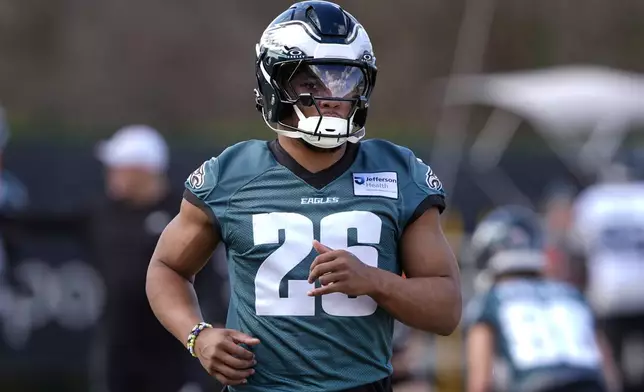 Philadelphia Eagles running back Saquon Barkley (26) runs through drills during an NFL football practice Wednesday, Feb. 5, 2025, in New Orleans, ahead of Super Bowl 59 against the Kansas City Chiefs. (AP Photo/Gerald Herbert)