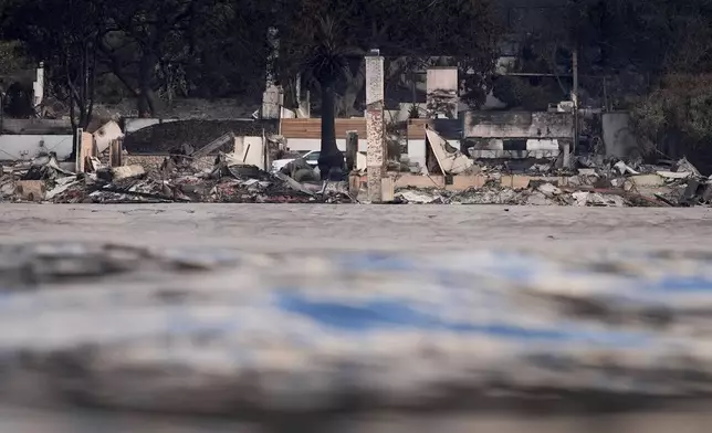 FILE - Properties damaged by the Palisades Fire are seen from a coastline perspective Friday, Jan. 17, 2025 in Malibu, Calif. (AP Photo/Carolyn Kaster, File)