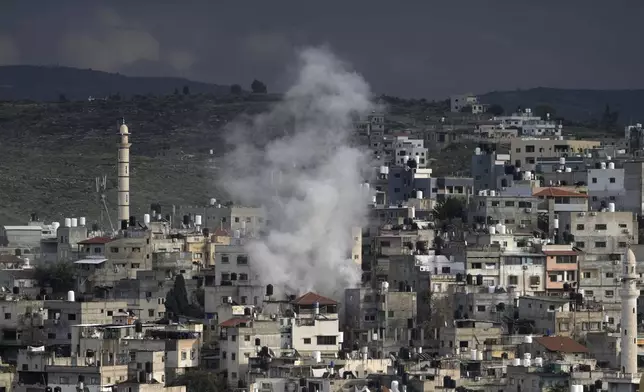 Smoke rises from an ongoing Israeli military operation in the West Bank Nur Shams refugee camp, Wednesday, Feb. 12, 2025. (AP Photo/Majdi Mohammed)