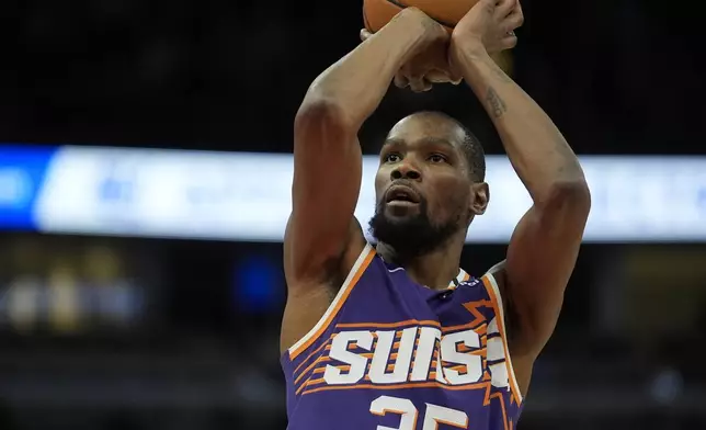 Phoenix Suns forward Kevin Durant (35) takes a free throw during the second half of an NBA basketball game against the Chicago Bulls, Saturday, Feb. 22, 2025, in Chicago. (AP Photo/Erin Hooley)