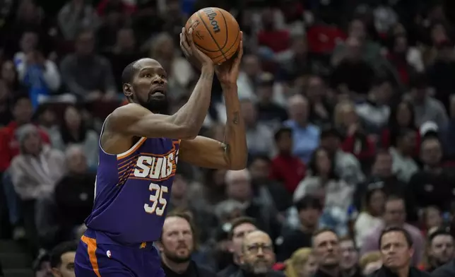 Phoenix Suns forward Kevin Durant (35) sinks a three-point shot during the second half of an NBA basketball game against the Chicago Bulls, Saturday, Feb. 22, 2025, in Chicago. (AP Photo/Erin Hooley)