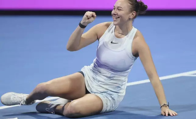Amanda Anisimova of the United States celebrates after winning the final against Latvia's Jelena Ostapenko at the Qatar Open tennis tournament in Doha, Qatar, on Saturday, Feb. 15, 2025. (AP Photo/Hussein Sayed)