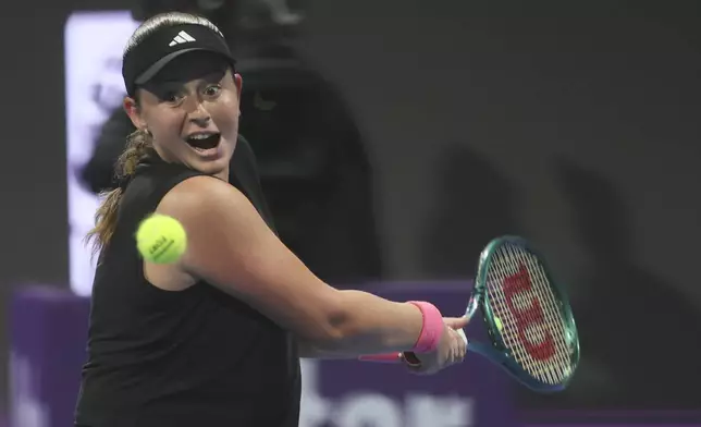 Latvia's Jelena Ostapenko returns to Amanda Anisimova of the United States during the Qatar Open tennis tournament final match in Doha, Qatar, on Saturday, Feb. 15, 2025. (AP Photo/Hussein Sayed)