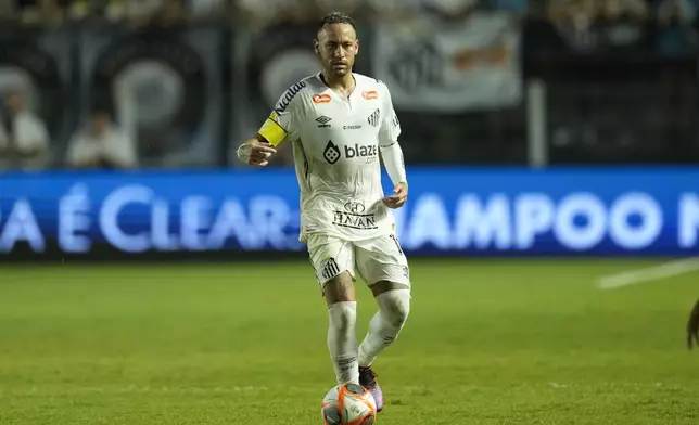 Brazil's Neymar dribbles the ball during his debut for Santos FC in a Sao Paulo league soccer match against Botafogo-SP, in Santos, Brazil, Wednesday, Feb. 5, 2025. (AP Photo/Andre Penner)