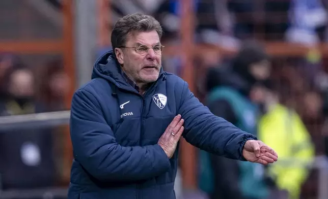 Bochum's head coach Dieter Hecking gestures during the German Bundesliga soccer match between VfL Bochum and Borussia Dortmund in Bochum, Germany, Saturday, Feb. 15, 2025. (David Inderlied/dpa via AP)