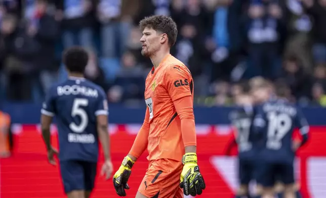 Dortmund's goalkeeper Gregor Kobel during the German Bundesliga soccer match between VfL Bochum and Borussia Dortmund in Bochum, Germany, Saturday, Feb. 15, 2025. (David Inderlied/dpa via AP)