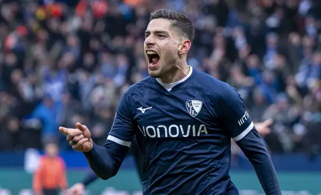Bochum's Georgios Masouras celebrates after scoring his side's second goal during the German Bundesliga soccer match between VfL Bochum and Borussia Dortmund in Bochum, Germany, Saturday, Feb. 15, 2025. (David Inderlied/dpa via AP)