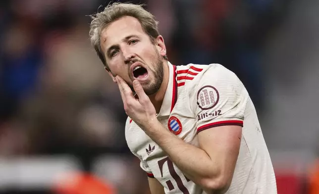 Bayern's Harry Kane reacts injured during the German Bundesliga soccer match between Bayer Leverkusen and FC Bayern Munich at the BayArena in Leverkusen, Germany, Saturday, Feb. 15, 2025. (Marius Becker/dpa via AP)