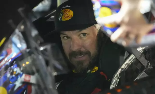 Martin Truex Jr., in his car, prepares for the start of the first of two NASCAR Daytona 500 qualifying auto races at Daytona International Speedway, Thursday, Feb. 13, 2025, in Daytona Beach, Fla. (AP Photo/John Raoux)