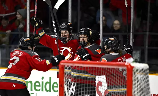 Ottawa Charge's Tereza Vanisova (13) reacts after scoring on Boston Fleet goaltender Aerin Frankel (31), not shown, to force overtime, during third period PWHL hockey action in Ottawa, on Thursday, Feb. 20, 2025. (Justin Tang/The Canadian Press via AP)