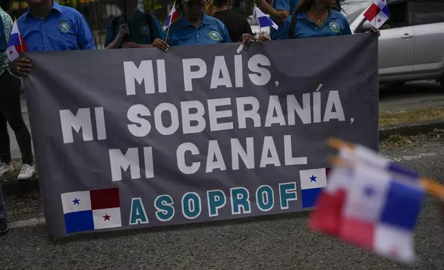 Demonstrators carry a sign that reads in Spanish: "My country, my sovereignty, my canal," referring to the Panama Canal, as they protest the upcoming visit of U.S. Secretary of State Marco Rubio in Panama City, Friday, Jan. 31, 2025. (AP Photo/Matias Delacroix)