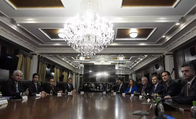 U.S. Secretary of State Marco Rubio, second right, meets with Panamanian President Jose Raul Mulino, left, at the presidential palace in Panama City, Sunday, Feb. 2, 2025. (AP Photo/Mark Schiefelbein, Pool)