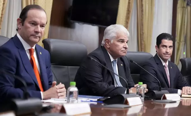 Panama's President Jose Mulino, center, and Foreign Minister Javier Martinez-Acha, let, meet with U.S. Secretary of State Marco Rubio at the presidential palace in Panama City, Sunday, Feb. 2, 2025. (AP Photo/Mark Schiefelbein, Pool)