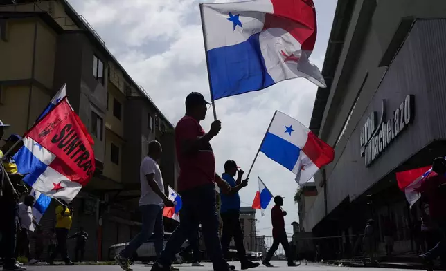 Protesters march against U.S. Secretary of State Marco Rubio's visit in Panama City, Sunday, Feb. 2, 2025. (AP Photo/Matias Delacroix)