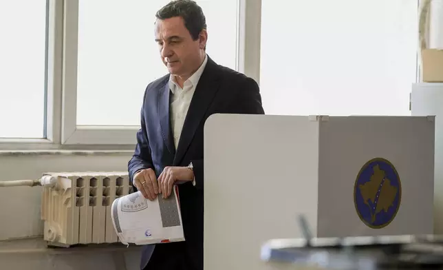 Albin Kurti, President of the left-wing Vetevendosje! party, prepares to cast his ballot as Kosovo holds a parliamentary election in Pristina, Kosovo, Sunday, Feb. 9, 2025. (AP Photo/Vlasov Sulaj)