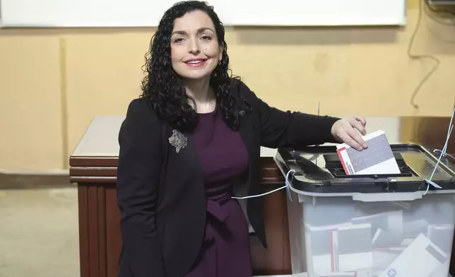 Kosovo's President Vjosa Osmani casts her ballot during parliamentary election in Pristina, Kosovo, Sunday, Feb. 9, 2025. (AP Photo/Vlasov Sulaj)