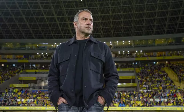 Barcelona's head coach Hansi Flick looks out prior the Spanish La Liga soccer match between Las Palmas and Barcelona at the Gran Canaria stadium in Las Palmas, Spain's Canary Islands, Saturday, Feb. 22, 2024. (AP Photo/Gabriel Jimenez)