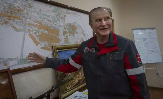 Taras Shevchenko, general manager of the Zaporizhstal Iron and Steelworks, one of the country's largest steel plants, shows the map of the steel mill in his office in Zaporizhzhia, Ukraine, Thursday, Feb. 13, 2025. (AP Photo/Efrem Lukatsky)