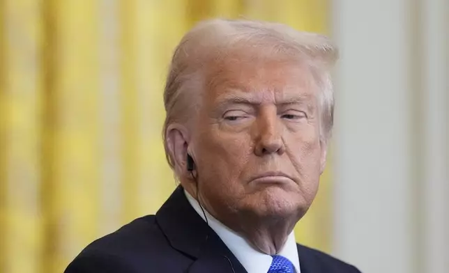 FILE - President Donald Trump listens during a news conference in the East Room of the White House, Friday, Feb. 7, 2025, in Washington. (AP Photo/Alex Brandon, File)