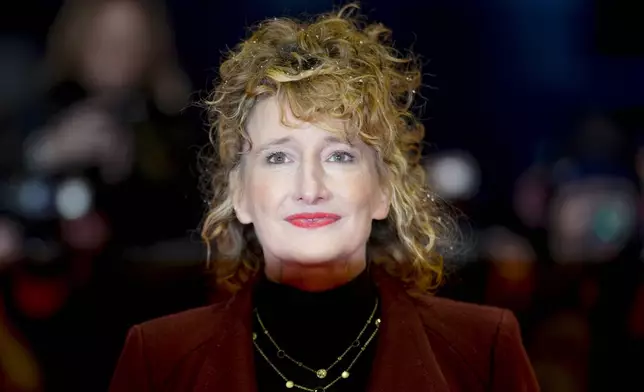 The Berlinale Festival Director, Tricia Tuttle poses for photographers upon arrival at the opening of the International Film Festival, Berlinale, in Berlin, Thursday, Feb. 13, 2025. (AP Photo/Markus Schreiber)