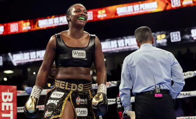 Claressa Shields, left, celebrates after defeating Danielle Perkins during the undisputed heavyweight title match on Sunday, Feb. 2, 2025 at Dort Financial Center in Flint. (Jake May/The Flint Journal via AP)