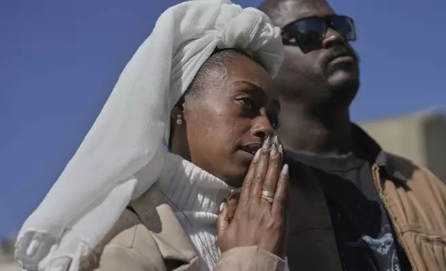 Israelis watch a broadcast of the release of Israelis Ofer Kalderon, 53, and Yarden Bibas, 34, and American-Israeli Keith Siegel, 65 as they are released as part of a ceasefire in the Gaza Strip, in Tel Aviv, Israel, Saturday Feb. 1, 2025. (AP Photo/Oded Balilty)