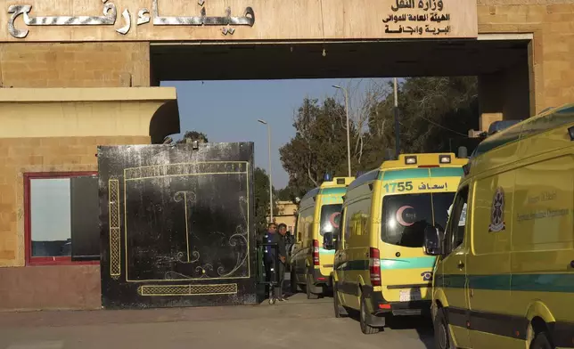 Egyptian ambulances cross the Rafah border crossing in Egypt, Saturday, Feb. 1, 2025. (AP Photo/Amr Nabil)