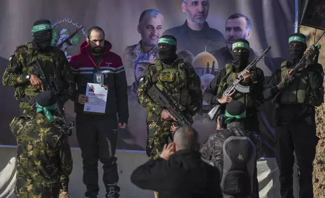 Israeli Yarden Bibas, 34, who has been held hostage by Hamas in Gaza since October 7, 2023, poses for pictures before being escorted by Hamas fighters before being handed over to the Red Cross in Khan Younis, southern Gaza Strip, Saturday Feb. 1, 2025. Photo/Abdel Kareem)