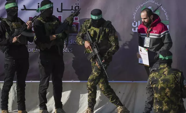 Israeli Yarden Bibas, 34, who has been held hostage by Hamas in Gaza since October 7, 2023, is escorted by Hamas fighters before being handed over to the Red Cross in Khan Younis, southern Gaza Strip, Saturday Feb. 1, 2025. Photo/Abdel Kareem)