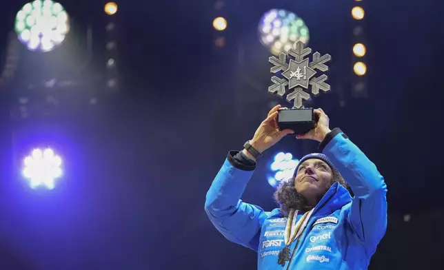 Italy's Federica Brignone shows her silver medal in a women's Super-G, at the Alpine Ski World Championships, in Saalbach-Hinterglemm, Austria, Thursday, Feb. 6, 2025. (AP Photo/Giovanni Auletta)