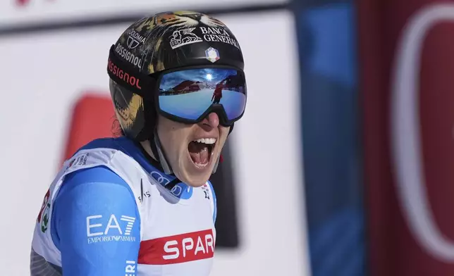 Italy's Federica Brignone celebrates at the finish area of a women's Super-G, at the Alpine Ski World Championships, in Saalbach-Hinterglemm, Austria, Thursday, Feb. 6, 2025. (AP Photo/Giovanni Auletta)