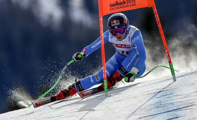 Italy's Sofia Goggia speeds down the course during a women's Super-G, at the Alpine Ski World Championships, in Saalbach-Hinterglemm, Austria, Thursday, Feb. 6, 2025. (AP Photo/Gabriele Facciotti)